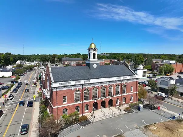 a photograph showing the town hall of needham ma