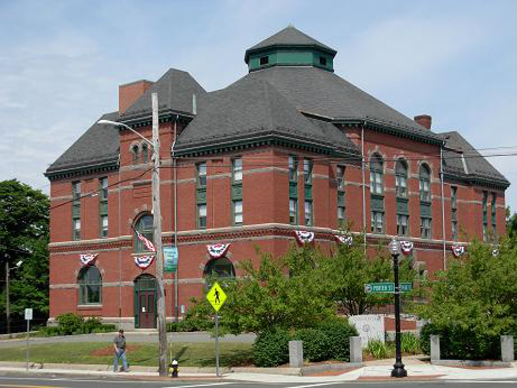 Stoughton, MA Town Hall, a red brick building with a green pyramidal roof