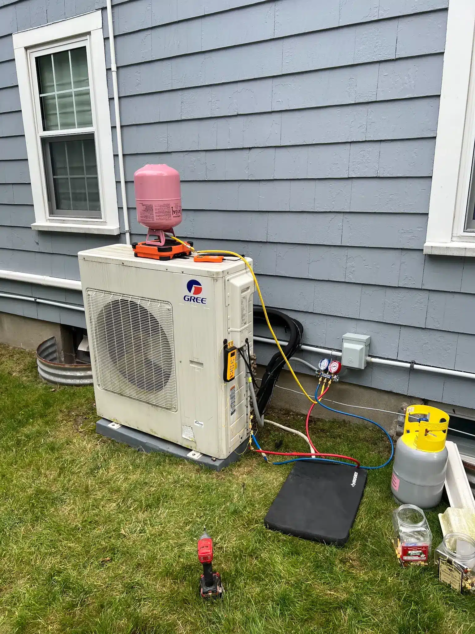 picture of air conditioning services being performed by proto home service in the surrounding areas of boston massachusetts